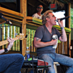 Live acoustic music performance at Pindar Vineyards during a wine tasting event.